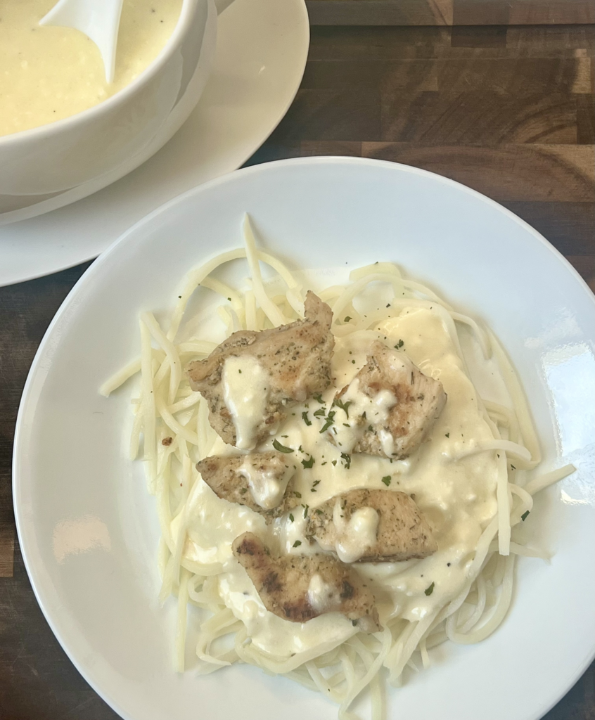 Chicken Alfredo made with Palmini noodles and creamy keto Alfredo sauce.