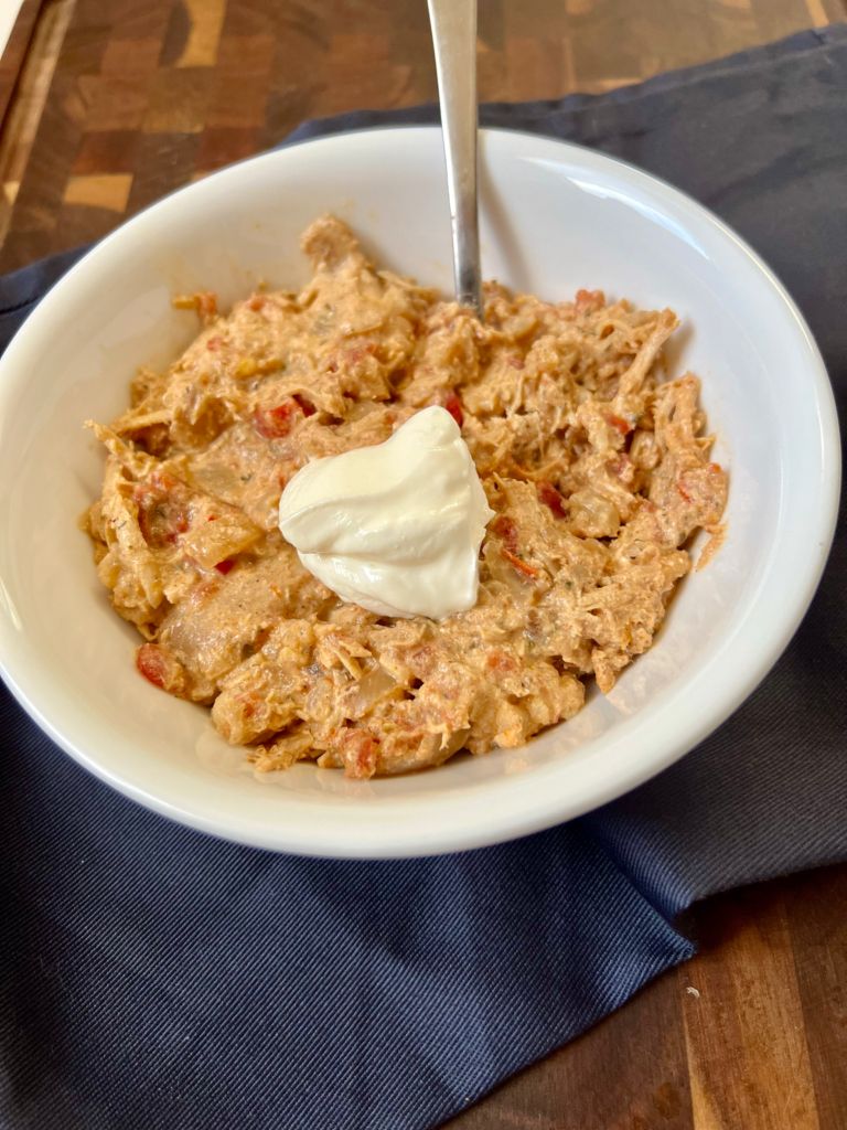 Creamy ranch chicken chili made with shredded chicken, cheese, and ranch seasoning in a bowl
