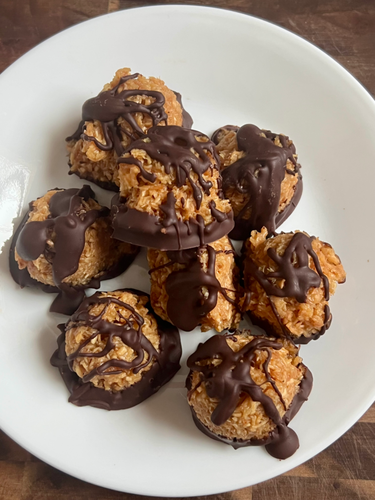 keto chocolate coconut cookies with toasted coconut and chocolate drizzle