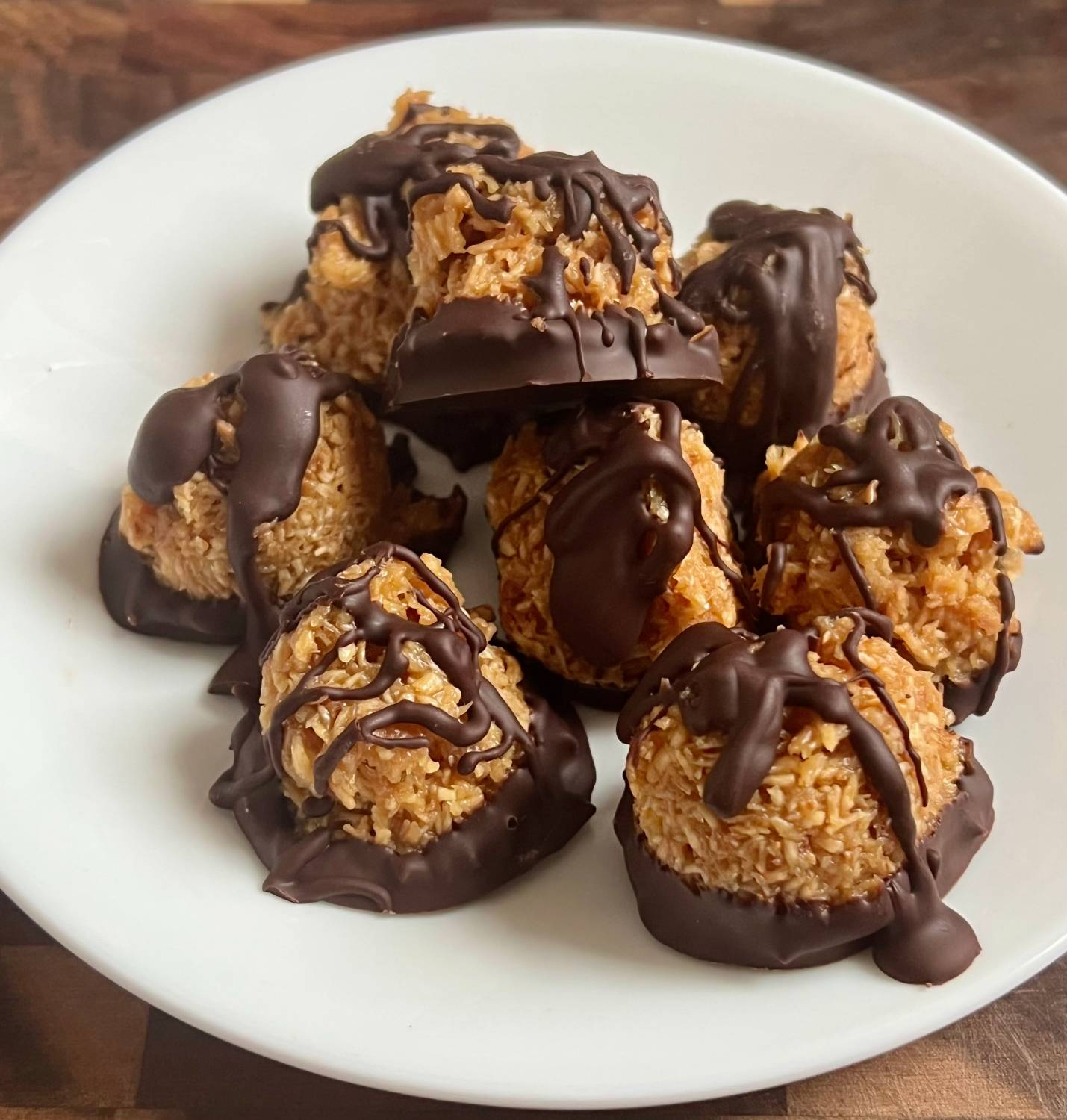 keto chocolate coconut cookies with toasted coconut and chocolate drizzle