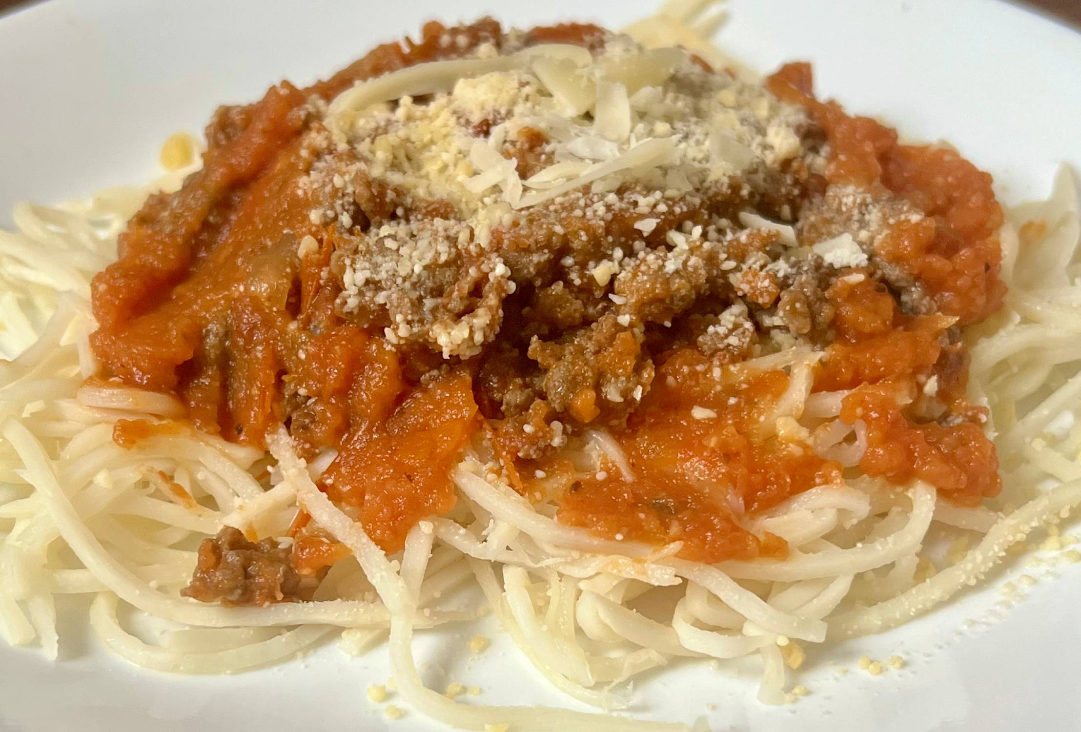 Keto spaghetti with homemade meat sauce and parmesan cheese
