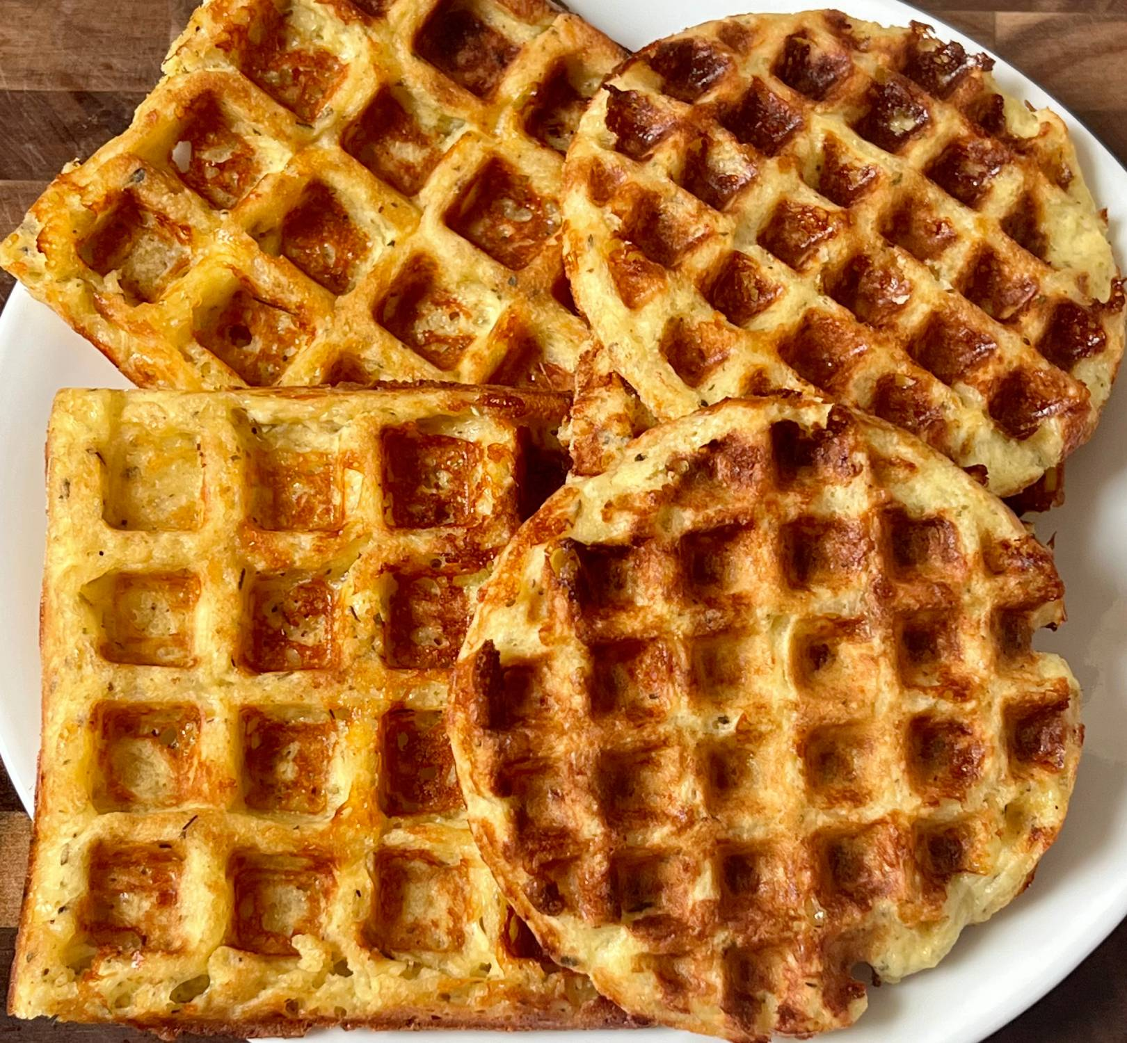 Savory keto garlic chaffle cooked until golden and crispy on a waffle iron