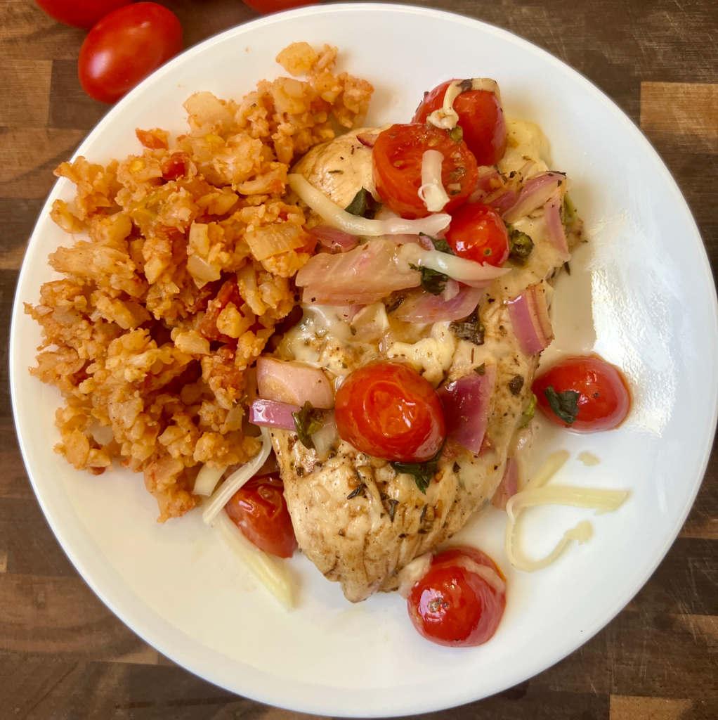Baked keto chicken bruschetta on a white plate