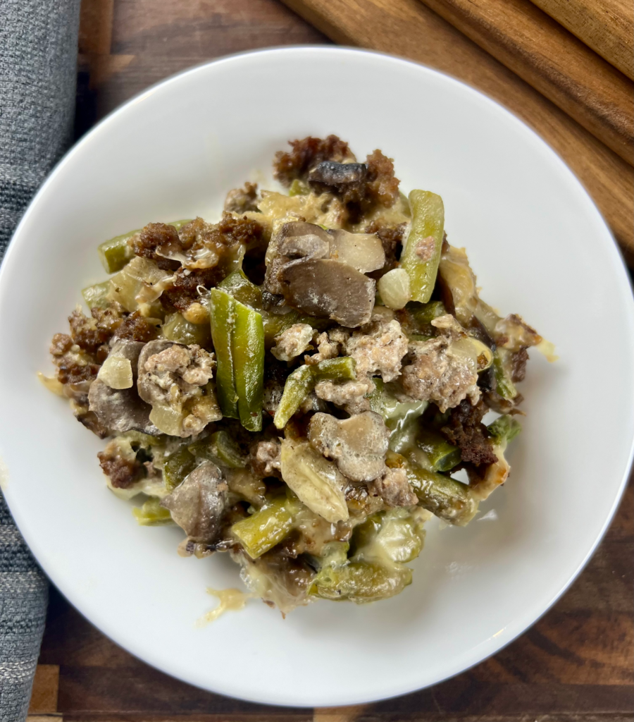 Creamy keto beef and green bean casserole with melted mozzarella and parmesan