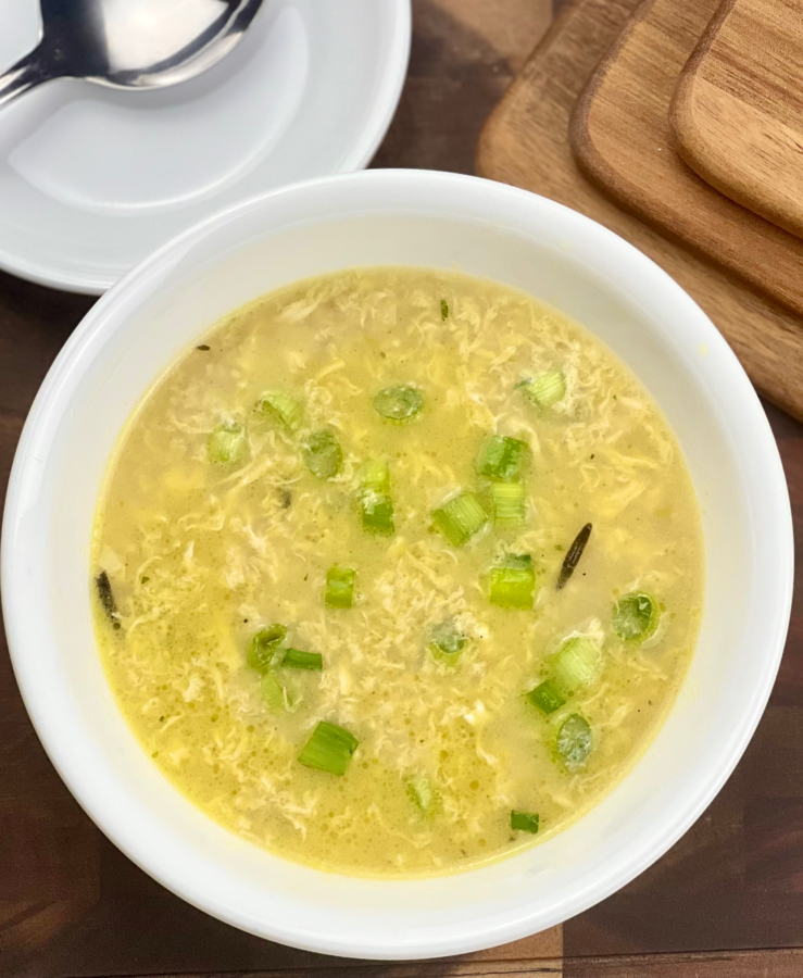 Easy keto egg drop soup recipe served warm in a bowl with green onion garnish.